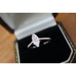 1.04CT DIAMOND SOLITAIRE RING - SET IN 18K WHITE GOLD WITH SHOULDER DIAMONDS