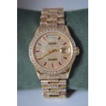 ROLEX DAY DATE 18K REF. 18038 DIAMOND-SET WITH RUBIES (BAGUETTES) - QUICK-SETTING