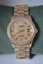 ROLEX DAY DATE 18K REF. 18038 DIAMOND-SET WITH RUBIES (BAGUETTES) - QUICK-SETTING