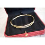 18K TRINITY GOLD BANGLE (YELLOW, WHITE & ROSE GOLD) - SIGNED 'CARTIER'