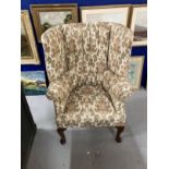 19th cent. Paisley upholstered high back porters chair, rib backed front pad feet shaped rear