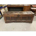 17th/18th cent. Oak and elm large coffer, the rectangular top with six panels carved frieze with