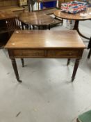 19th cent. Mahogany two drawer side table with brass ring handles, chamfered edge to the top, reeded
