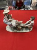 20th cent. Ceramics: Lladro figurine Seesaw Friends 6169, boy and girl with older girl on seesaw