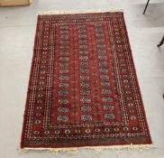 Carpets & Rugs: Late 19th/early 20th cent. Turkman rug, red ground with a central panel containing