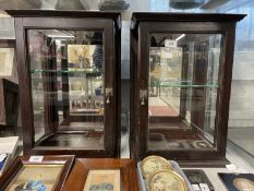 Early 20th cent. Mahogany display cabinets, glazed to three sides with a glass shelf, a pair. 19½