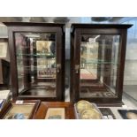 Early 20th cent. Mahogany display cabinets, glazed to three sides with a glass shelf, a pair. 19½