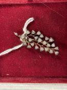 Jewellery: Yellow metal brooch in the form of a spray set with twenty-three old cut diamonds,