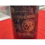 Wine: 1930s Chateau Loudenne Grand Vin Medoc , wine at shoulder level.