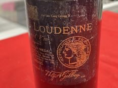 Wine: 1930s Chateau Loudenne Grand Vin Medoc , wine at shoulder level.