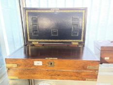 19th cent. Rosewood writing box, brass corners, central brass plaque, sunken brass handles, the