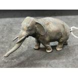 Oriental white metal Asian elephant, character seal mark to base. Length 5ins. Height 2¾ins.