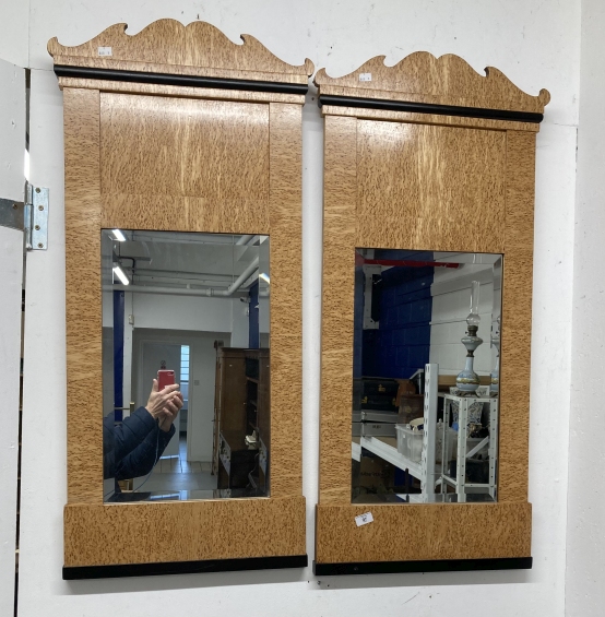 20th cent. Biedermeier style mirrors veneered in maple with shaped tops, ebonised moulding and