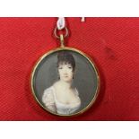 French School: Early 19th cent. Miniature, a lady in a yellow metal frame. Dia. 1?ins. Ivory