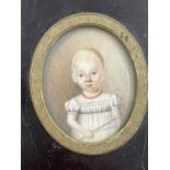 English School: 19th cent. Oval miniature, a child in a white dress in an ebonised frame. 2½ins. x