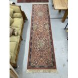 Carpets & Rugs: 20th cent. Keshan runner, red ground with stylised floral decoration and one
