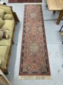 Carpets & Rugs: 20th cent. Keshan runner, red ground with stylised floral decoration and one