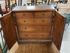 19th cent. Mahogany collectors cabinet, two arched doors opening to reveal two short over three long