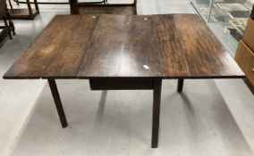 Early 19th cent. Oak drop leaf table, rectangular top supported by square chamfered legs. 26½ins.