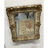 19th cent. Gilt and painted small mirror. 15¾ins. x 13½ins.