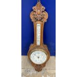 Edwardian oak cased aneroid barometer, mercury thermometer, unsigned. 36ins. x 12ins.