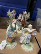 19th cent. Porcelain group, two figures in a romantic pose on a round gilded base, marked R in blue.