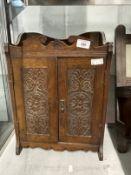 Edwardian mahogany smokers cabinet with floral carving to doors. 12½ins. x 7ins. x 18ins. Plus an