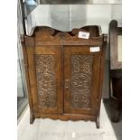 Edwardian mahogany smokers cabinet with floral carving to doors. 12½ins. x 7ins. x 18ins. Plus an