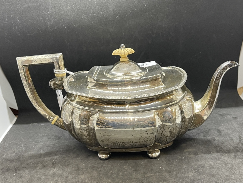Hallmarked Silver: Teapot, reed pattern with gadroon border on four ball feet, hallmarked Chester.
