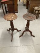 Late 19th cent. Mahogany plant stands, circular tops on turned columns with a tripod base, a pair.