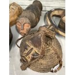 Tribal Art: Mambila mask with two heads and an Ambete mask and hat. (2)