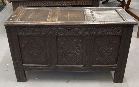 Early 18th cent. Carved oak coffer with hinged rectangular lid, three panel front with diamond