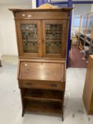 Arts and Crafts oak bureau bookcase of small proportions, leaded glass bookcase doors, the bureau