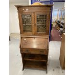 Arts and Crafts oak bureau bookcase of small proportions, leaded glass bookcase doors, the bureau