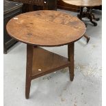 19th cent. Pine cricket table, two piece round top, triangular legs supporting an under shelf with