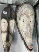 Tribal Art: Two fang masks. (2)