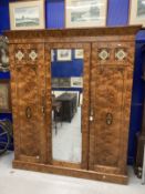 19th cent. Aesthetic/arts and craft three door figured ash veneer compactum/wardrobe. The central