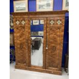 19th cent. Aesthetic/arts and craft three door figured ash veneer compactum/wardrobe. The central