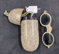 18th/19th cent. Ophthalmic: Horn folding tinted glasses, one arm A/F enclosed in a shagreen case.