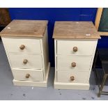 20th cent. Painted pine bedside cupboards, each with three drawers, knob handles on plinth bases,