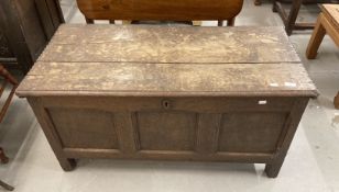 Late 18th cent. Oak coffer the two plank top with moulded edge to the front. The front with three