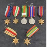 Militaria & Medals: A collection of seven WWII medals including The Pacific Star, The Italy Star,