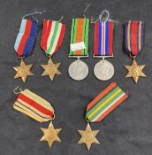 Militaria & Medals: A collection of seven WWII medals including The Pacific Star, The Italy Star,