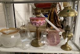 Lighting: Brass round base oil lamp, round column, pink glass reservoir with painted swags and