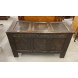 Early 18th cent. Carved oak coffer with hinged rectangular lid, three panel front with diamond