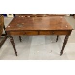 19th cent. Mahogany two drawer side table, the top with a moulded edge, the drawers with wooden