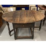 18th cent. Oak gate leg table, single drawer to each end on turned supports with a tied stretcher,