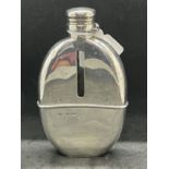 Hallmarked Silver: Hip flask with liner of oval shape, London 1881 Mordan & Co. 5¼ins. x 3¼ins.