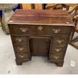 18th cent. Mahogany knee hole desk the top with moulded edge above a long drawer with a secret