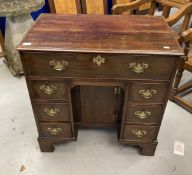 18th cent. Mahogany knee hole desk the top with moulded edge above a long drawer with a secret